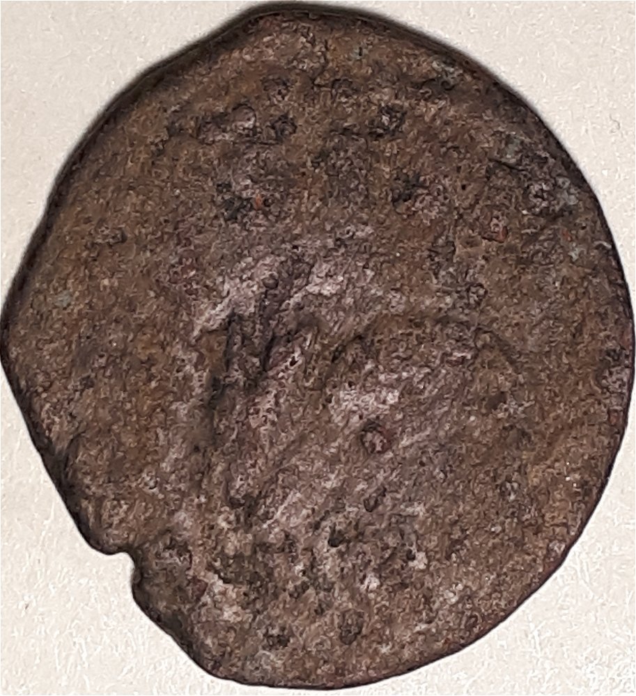 Unknown-Coin-With-A-Shield-And-A-Few-Letters