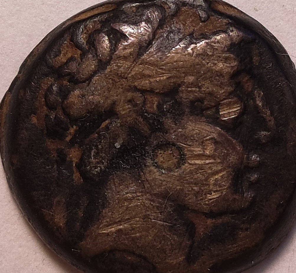 Last-Greek-Coin-With-A-Galley-Prow-And-Bust.-Some-Letters