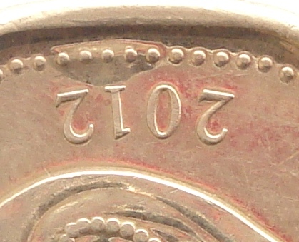 2012-Loonie---New-Has-Mountain-On-Obverse?-Die-Error?