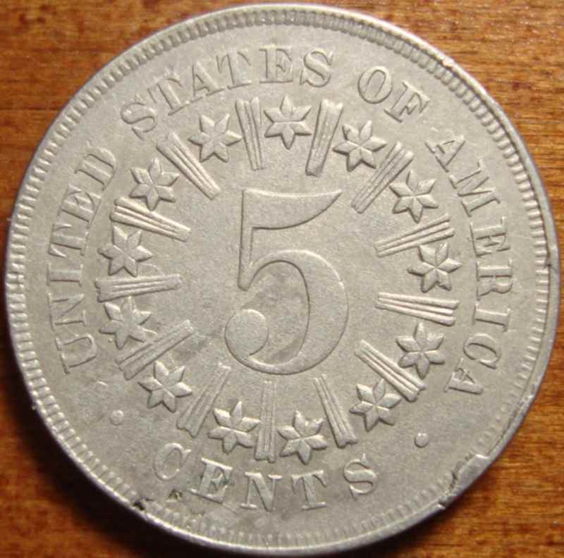 Shield-Nickel---Die-Pair-On-The-Way-To-The-Trash