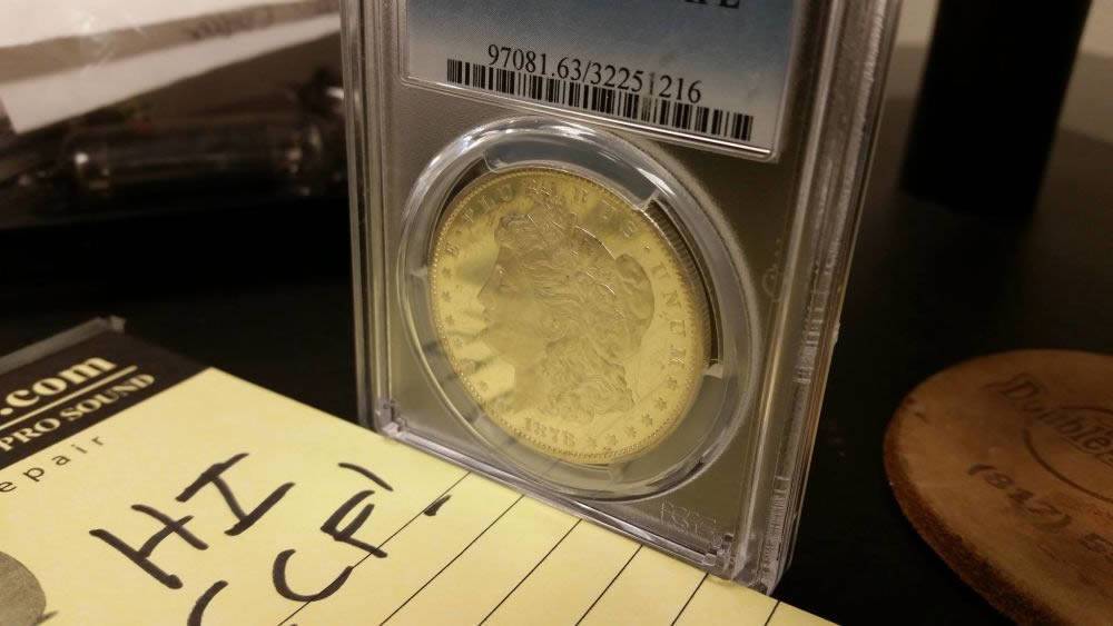 Old-1878-Morgan-$1,-Kinda-Shiny,-In-Plastic-Holder,-Grade?