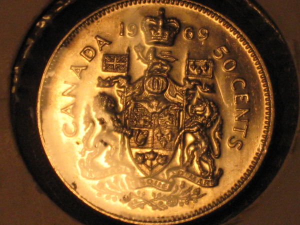 Five-Unc/Pl-50-Cent-Pieces,-Confused-About-Grades