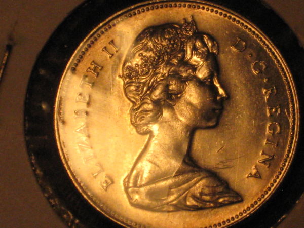 Five-Unc/Pl-50-Cent-Pieces,-Confused-About-Grades