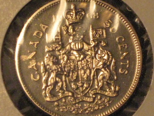 Five-Unc/Pl-50-Cent-Pieces,-Confused-About-Grades