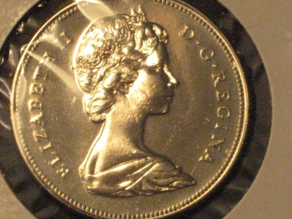 Five-Unc/Pl-50-Cent-Pieces,-Confused-About-Grades