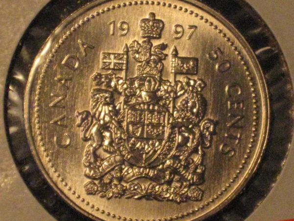 Five-Unc/Pl-50-Cent-Pieces,-Confused-About-Grades