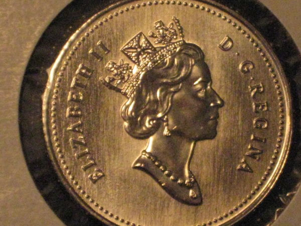 Five-Unc/Pl-50-Cent-Pieces,-Confused-About-Grades