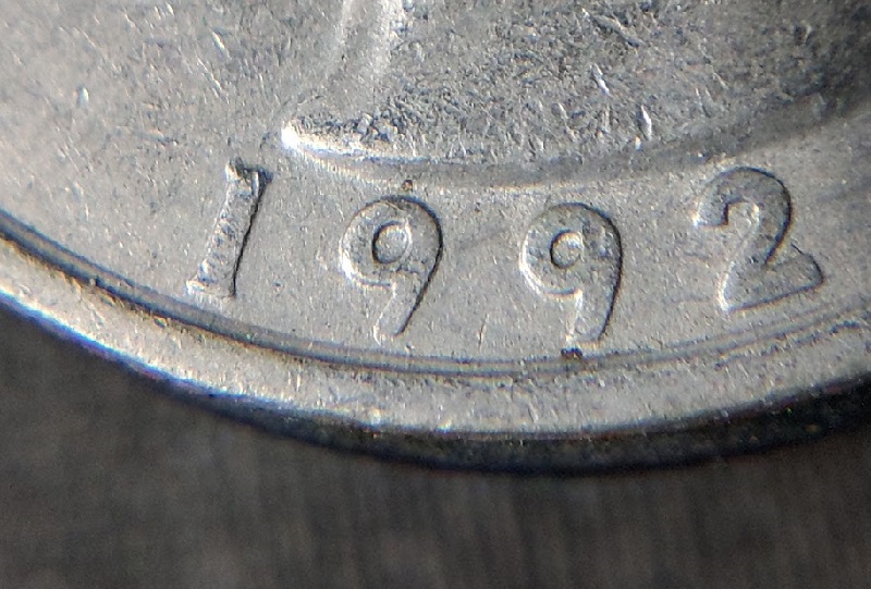 1992-P-25c-With-A-Die-Anomaly?-Where-The-Rim-Meets-The-Field,-OBV-&-Rev.