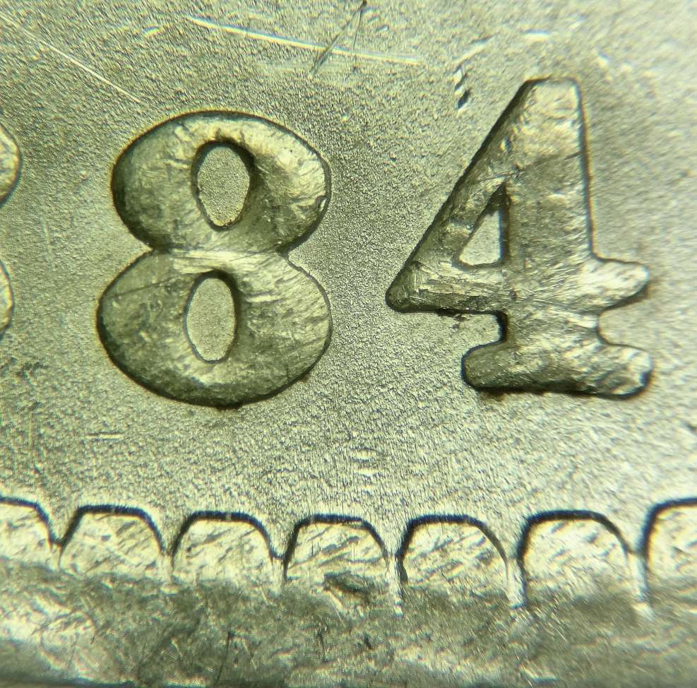 1884-O/O-With-O-Filled-In-Showing-Horizontal-Die-Lines.-VAM?
