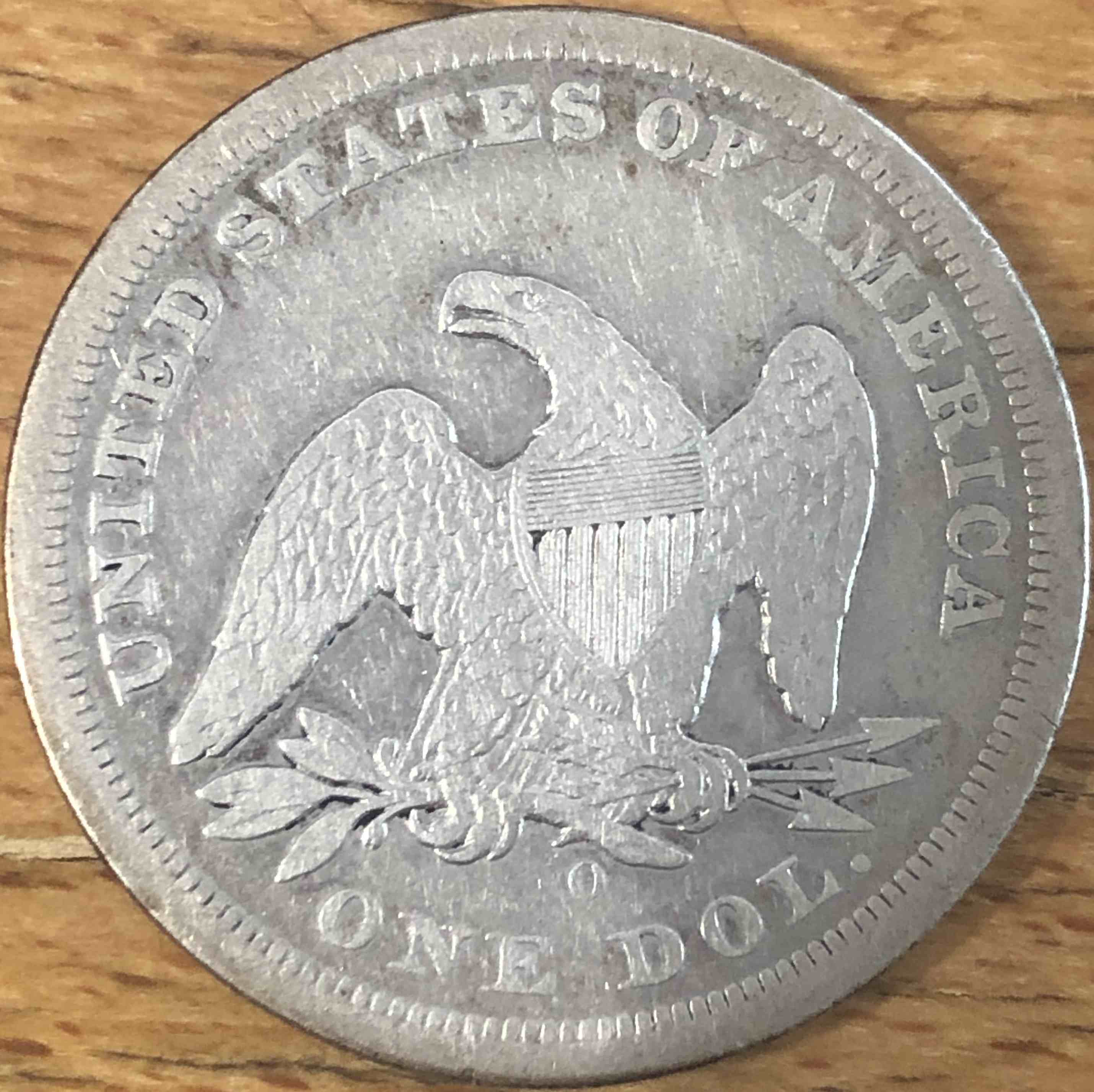 1860-O-Seated-Liberty-Dollar
