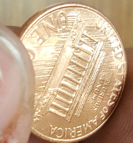 1998-Penny.-Small-Cud-On-REV-And-Several-Marks-Across-Under-Mem-And-Letters