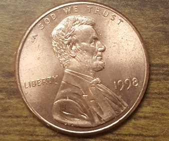 1998-Penny.-Small-Cud-On-REV-And-Several-Marks-Across-Under-Mem-And-Letters
