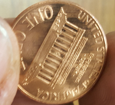 1998-Penny.-Small-Cud-On-REV-And-Several-Marks-Across-Under-Mem-And-Letters