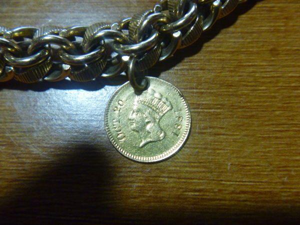 Small-Gold-Coin-As-Part-Of-A-Bracelet-|-US-Gold-Dollar