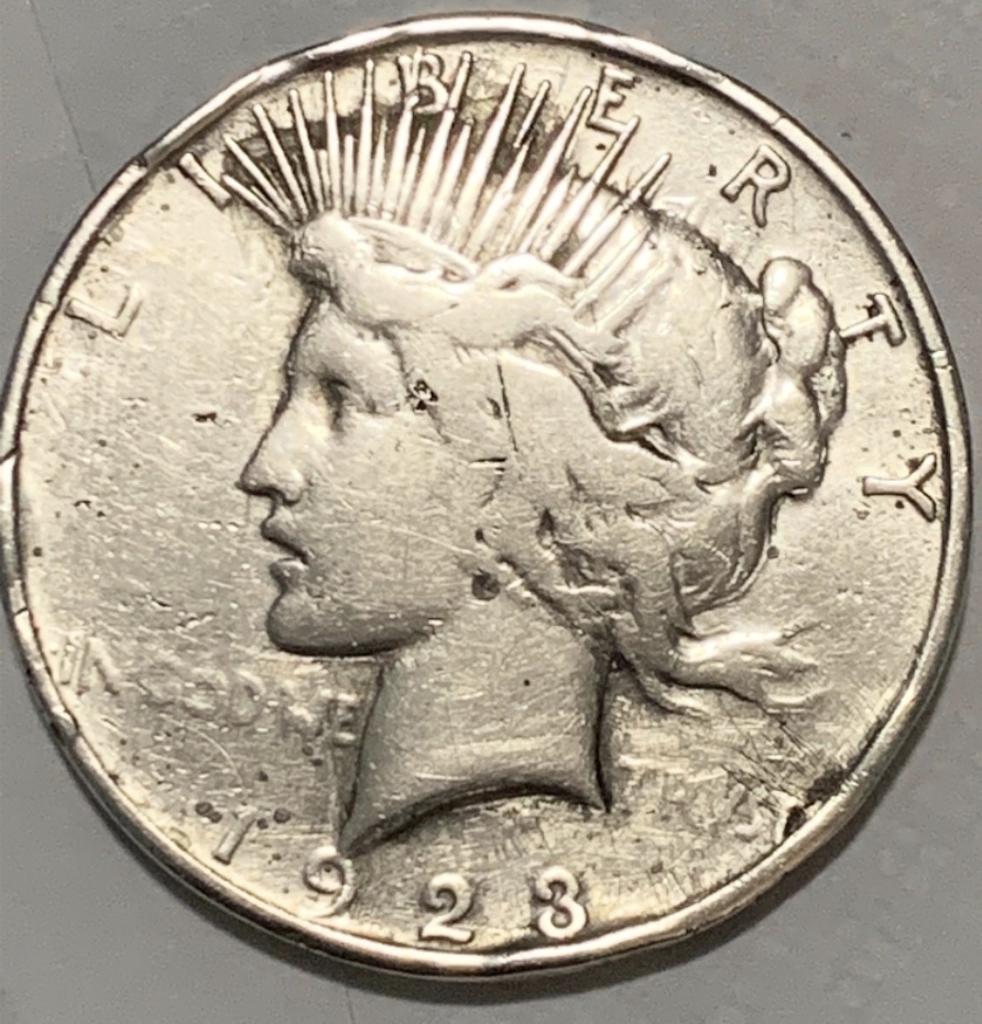 1923-Peace-Silver-Front-And-The-Back-1925-Peace-Silver