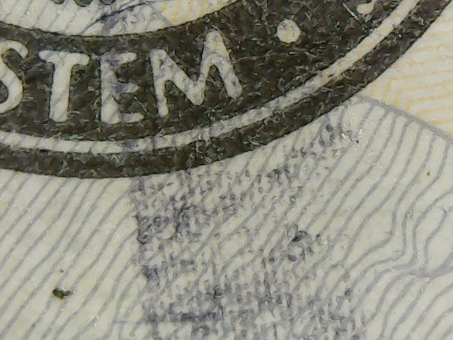 2013-20-Dollar-With-Wierd-Blue-Stripe-Across-Face?
