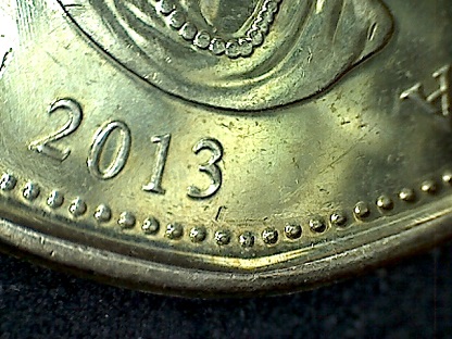 2013-Loonie-Mark-Lower-Right-Of-3?