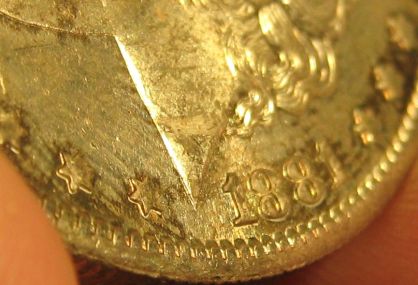 1881-S-Morgan-Strike-Though-Something-Wood-Maybe?--Or-Just