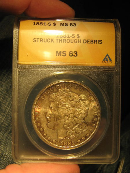 1881-S-Morgan-Strike-Though-Something-Wood-Maybe?--Or-Just