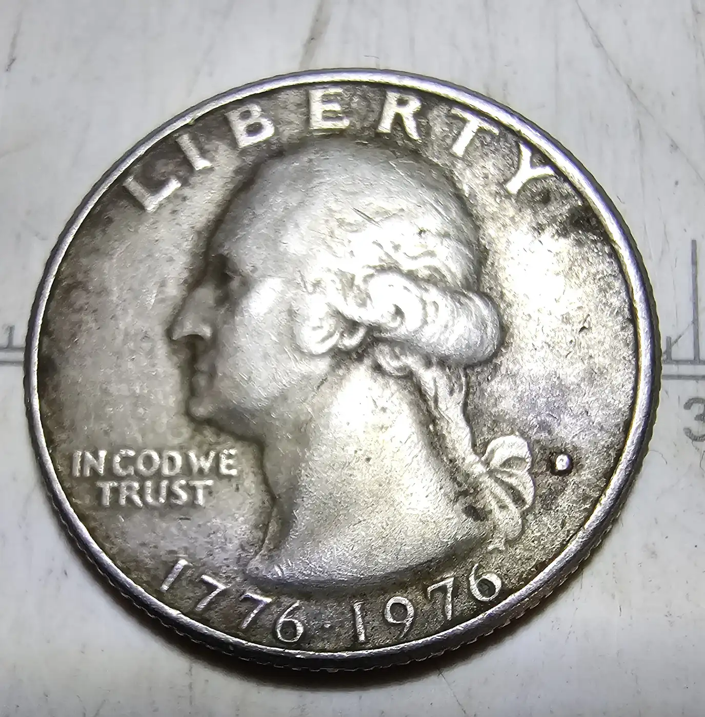 1976-Quarter-Filled-In-Mint-Mark,-Reverse-Drummers-Arm