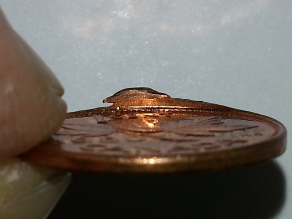 1980-Penny-Slight-Clip/Extra-Rim-Metal/Struck-Off-Center