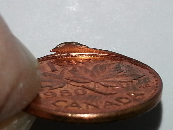 1980-Penny-Slight-Clip/Extra-Rim-Metal/Struck-Off-Center