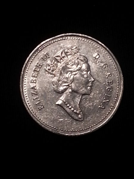 1995-25-Cent-Struck-Through-Or-Planchet-Flaw-Or-PMD?