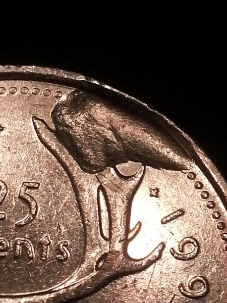 1995-25-Cent-Struck-Through-Or-Planchet-Flaw-Or-PMD?