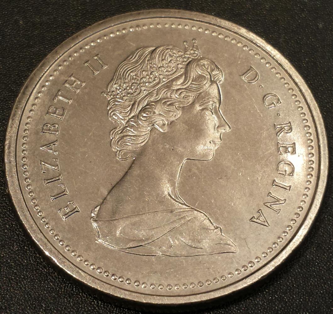 197?-1-Dollar-Struck-Through-Or-Planchet-Flaw?