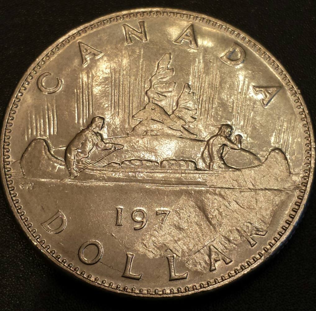 197?-1-Dollar-Struck-Through-Or-Planchet-Flaw?
