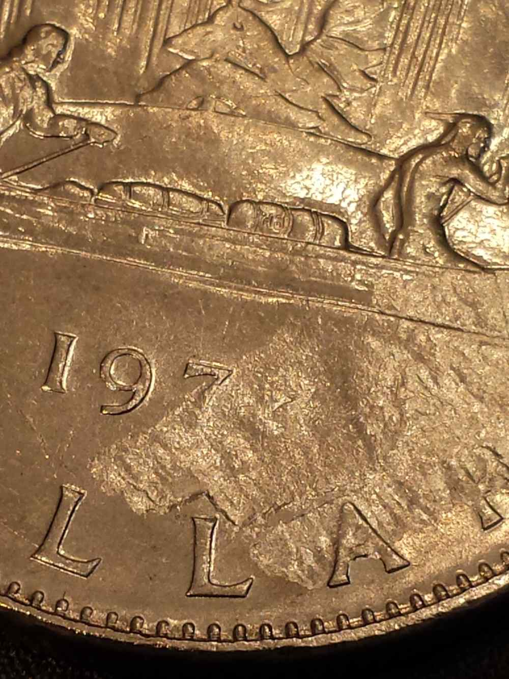 197?-1-Dollar-Struck-Through-Or-Planchet-Flaw?