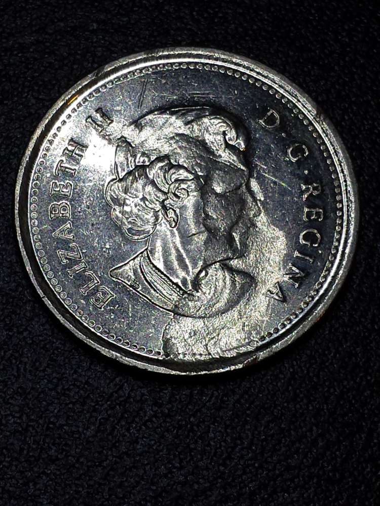 2005-Alberta-25-Cents-With-Large-Strike-Through