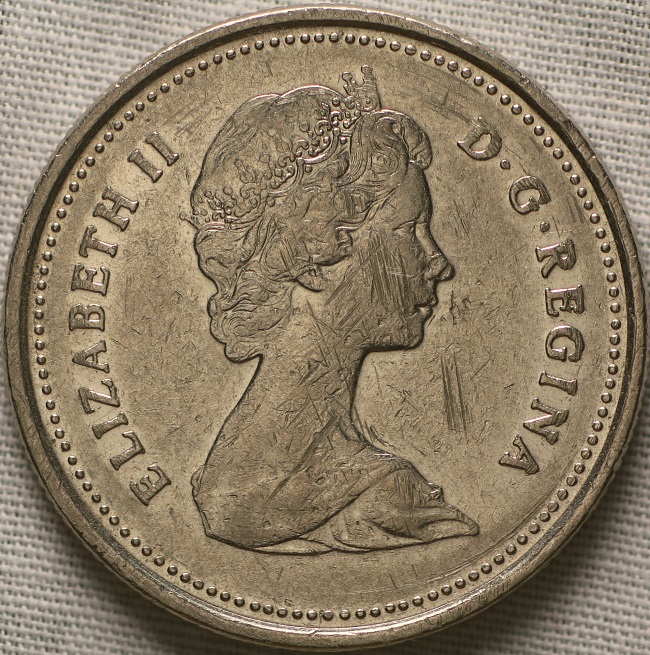 1980-Canadian-Twenty-Five-Cent-Coin-Near-And-Far-Beads