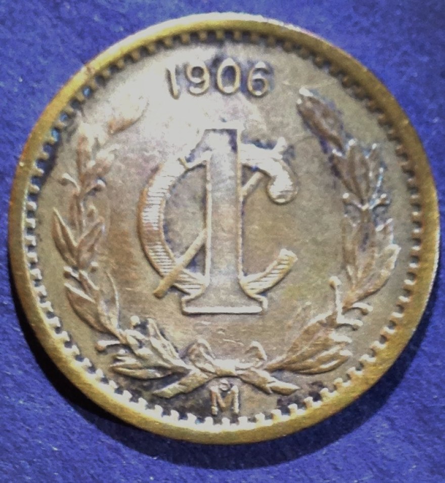 Bronze-Centavo-In-Hand-Toning-Not-Photographing