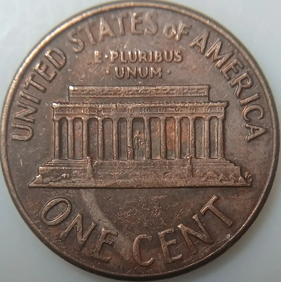 1970-Lincoln-Penny-With-Unknown-Design-In-Front-Of-The-Portrait.