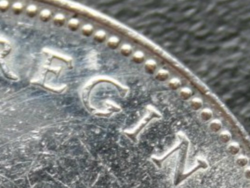 1966-Canadian-Silver-Dollar-Large-Bead-I-Assume?