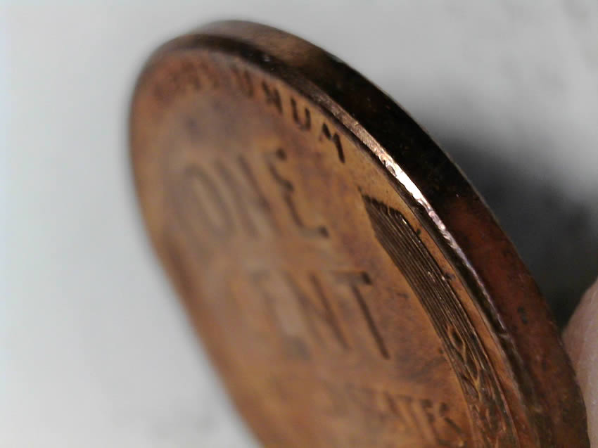 1957-D-Cent-Clipped-Planchet-With-Blakesly-Effect