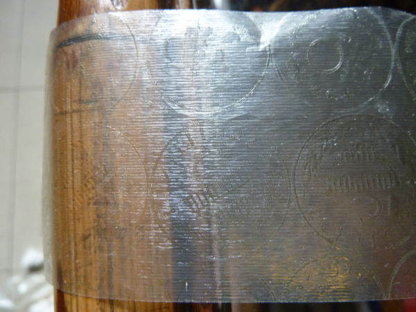 Help-With-A-Coin-And-Amazingly-Resilient-Tape-Residue