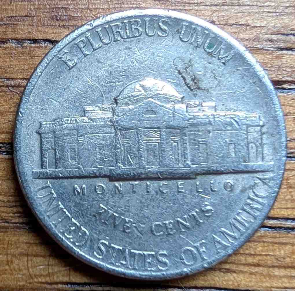 Jefferson-Nickel-Struck-In-Metal-Fragment