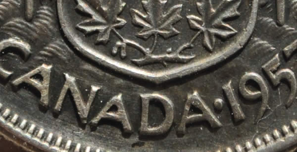 1957-50-Cents-With-Extra-Metal-On-5-In-Date