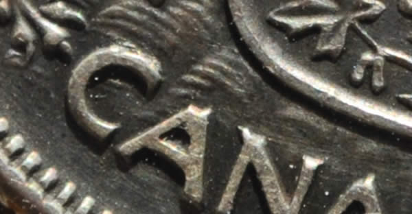1957-50-Cents-With-Extra-Metal-On-5-In-Date