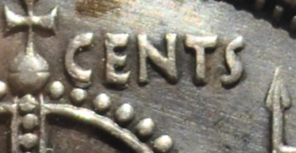 1957-50-Cents-With-Extra-Metal-On-5-In-Date