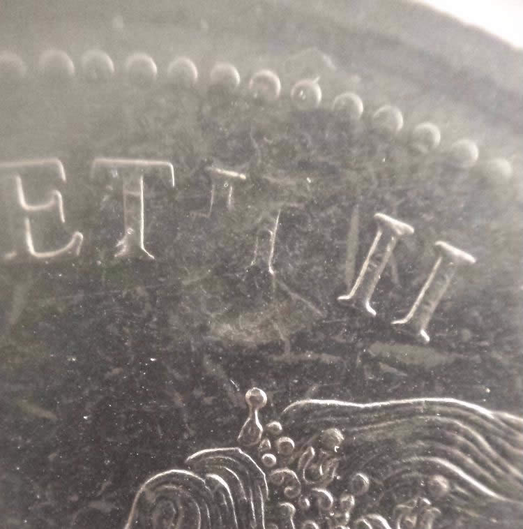 1974-Nickel-Dollar-With-Obverse-Planchet-Flaw-Or-Strike-Through