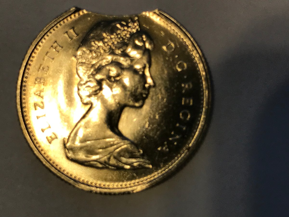 1975-25-Cents-Clipped-Planchet---Specimen-Strike