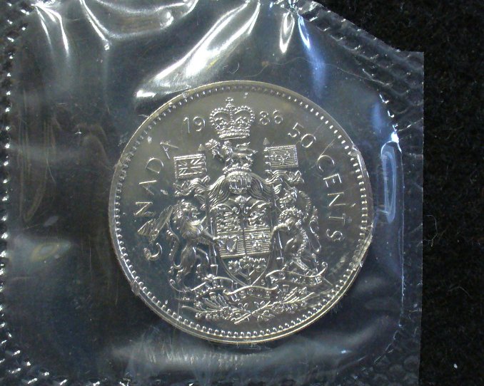 1986-PL-Coin-Sealed-With-Damage..50-Cent-Piece..