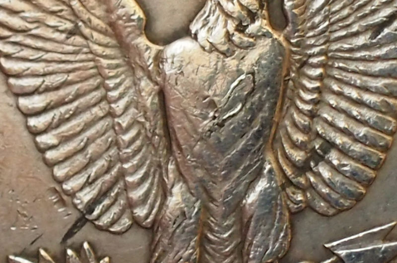 Excess-Metal-On-1921-Philadelphia-Morgan-At-Chest