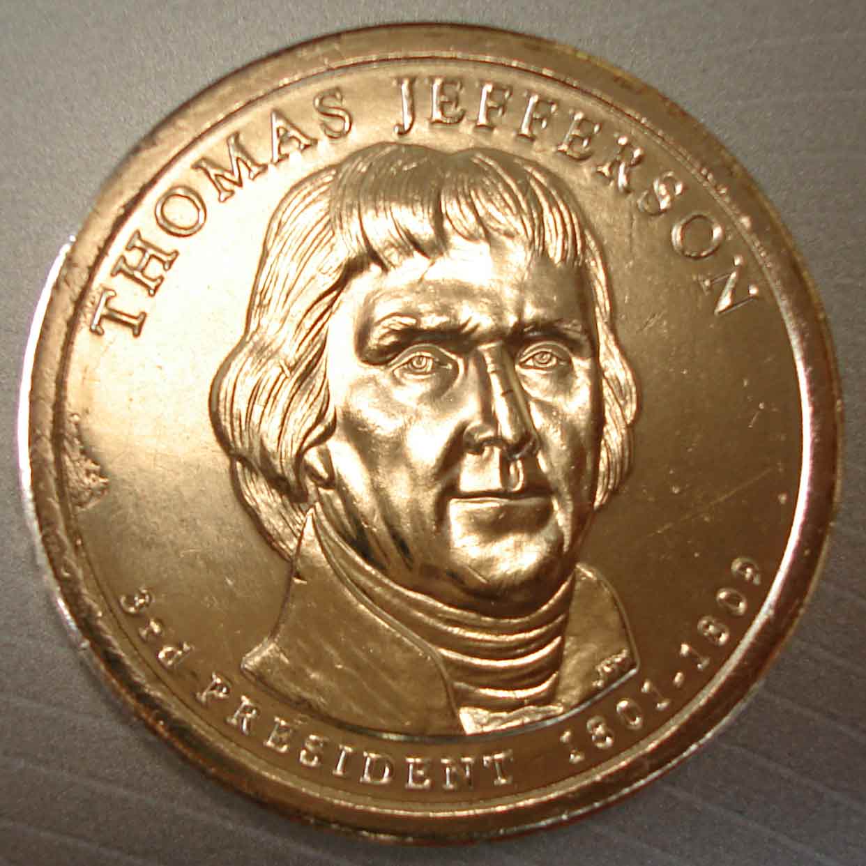 Jefferson-Dollar-Struck-Thru-Or-Mint-Damage?