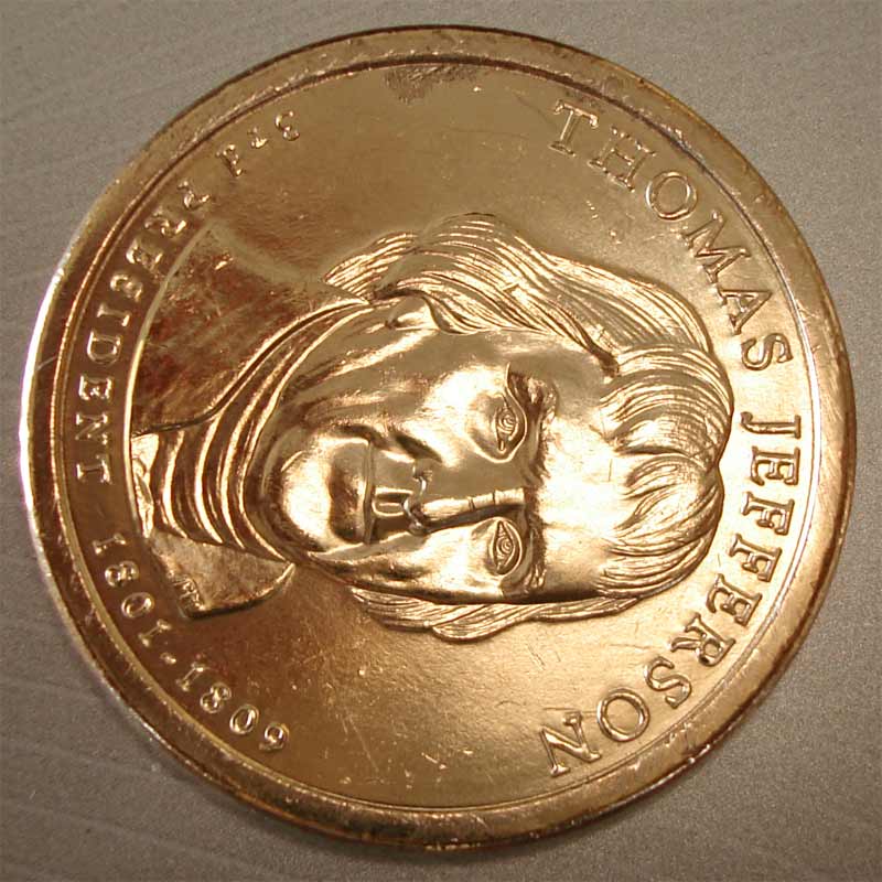 Jefferson-Dollar-Struck-Thru-Or-Mint-Damage?