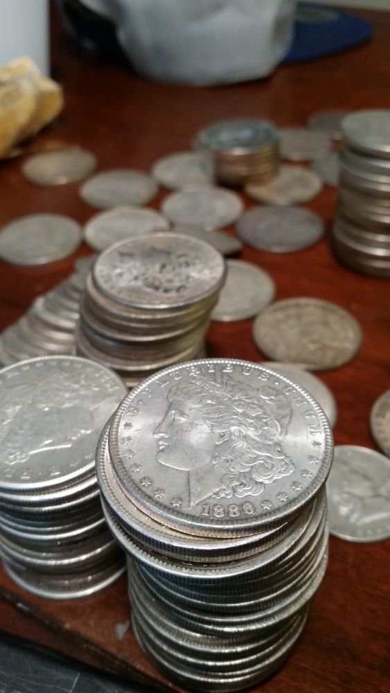 Small-Horde-Of-Morgans-And-Peace-Dollars