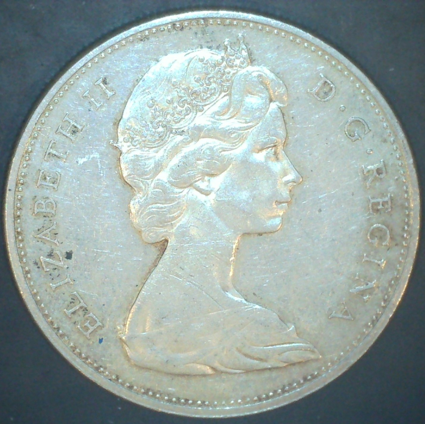 1965-Silver-Dollar---'6'-At-Odd-Angle.-Seeking-Information